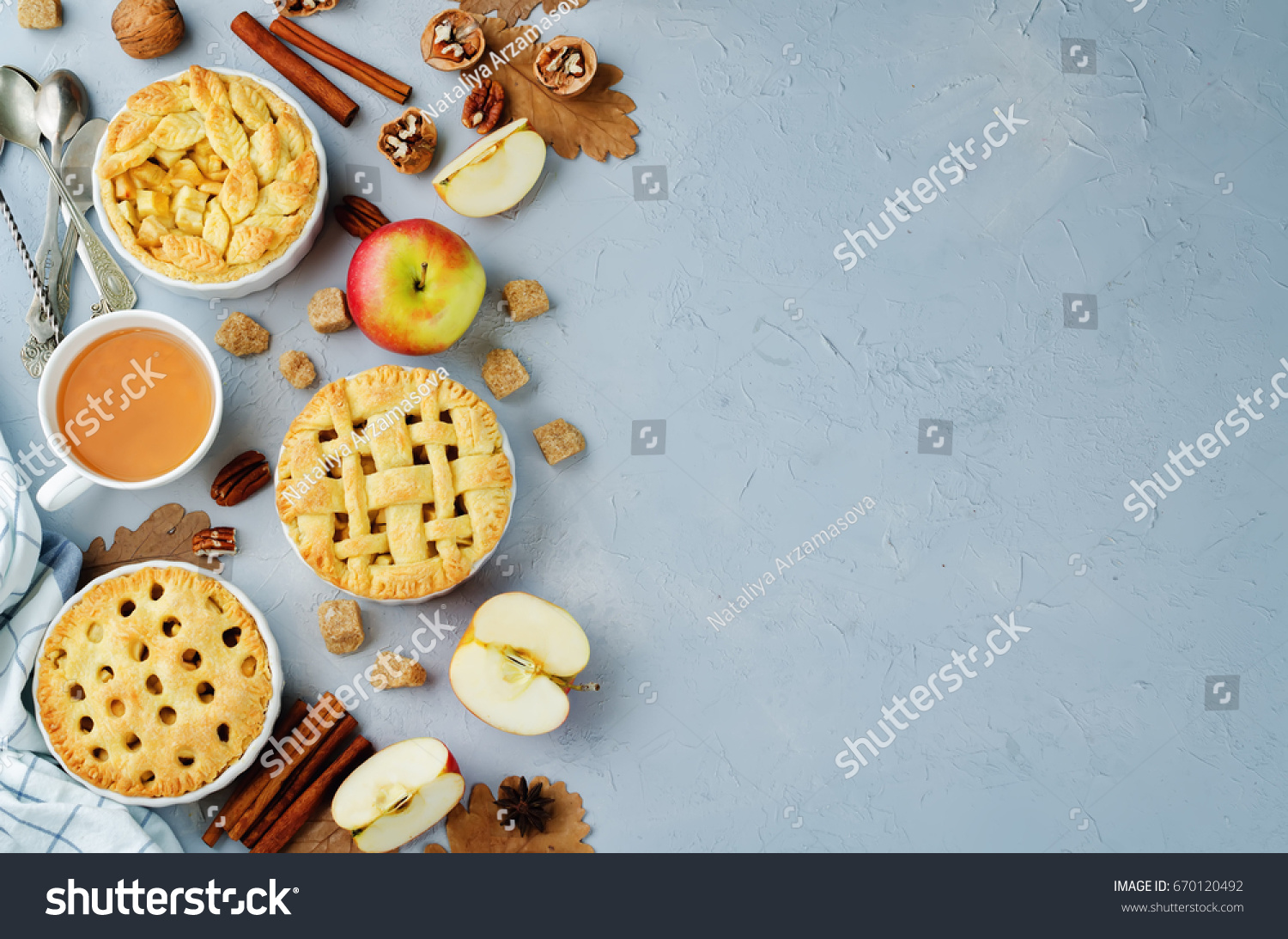 Apple pies with different design on a grey background. toning. selective focus #670120492
