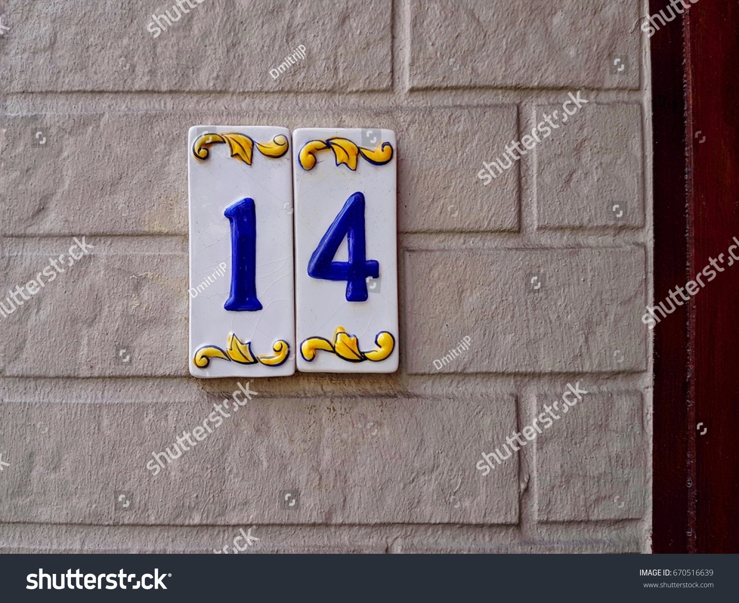 House number on the wall fourteen 14 #670516639