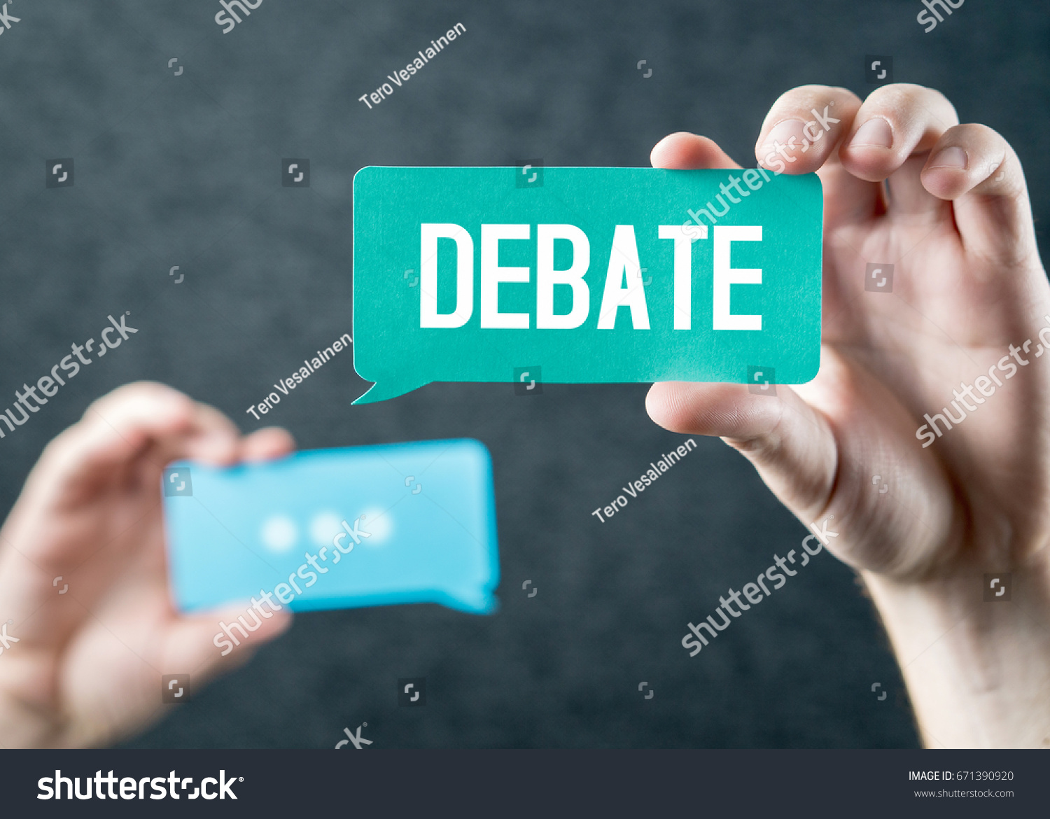 Debate, argument, controversy and disputation concept. Learning to be better speaker. Education to improve dialog. Tell opinions and thoughts in public. Hands holding cardboard speech bubble. #671390920