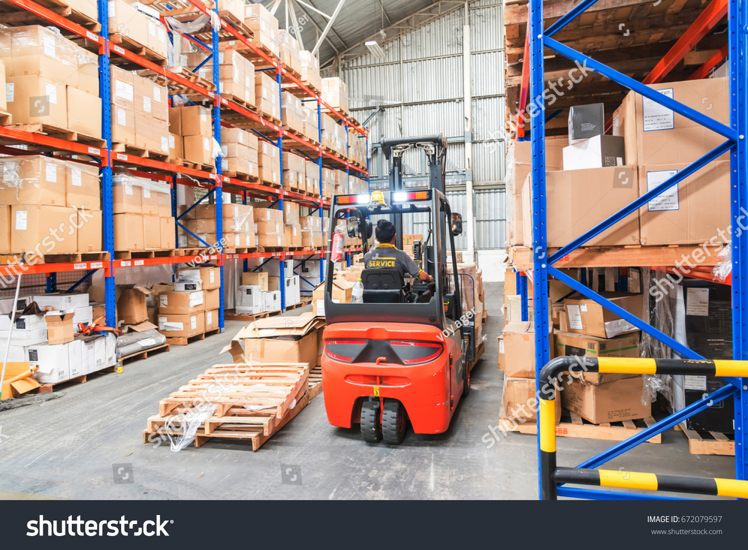 Forklift in Warehouse storage of retail merchandise shop.  #672079597