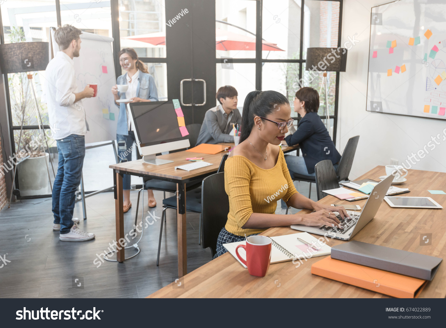 Group of creative worker brainstorm together in office, new style of workspace #674022889
