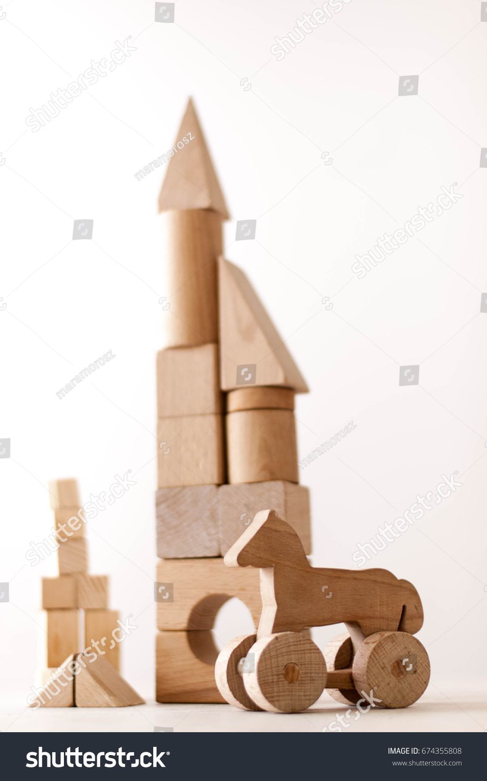 wooden houses made from  different wooden shapes and forms for kids skills developments #674355808