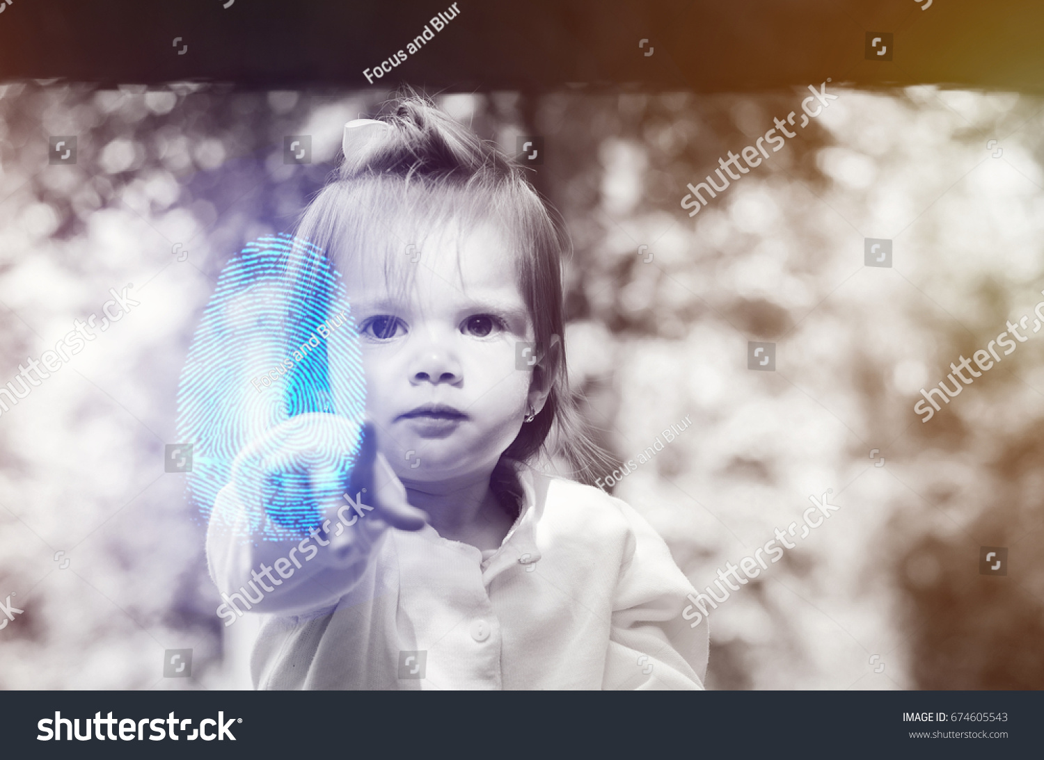baby two years pointing a fingerprint at the camera, digital and copy space #674605543