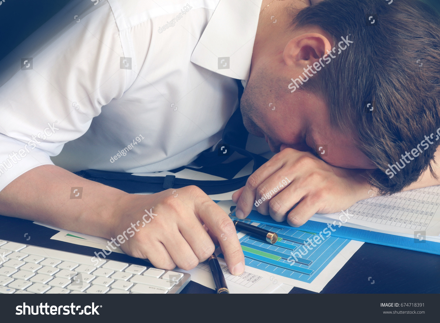 Chronic fatigue syndrome concept. Overworked businessman is sleeping at desk. #674718391