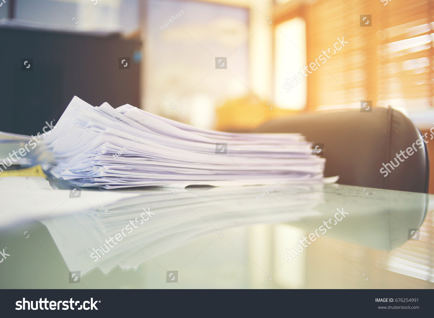 Paper business documents of unfinished stacked on office desk archive,in archive analyzing the market and considers on the size of future profits on table office. #676254991