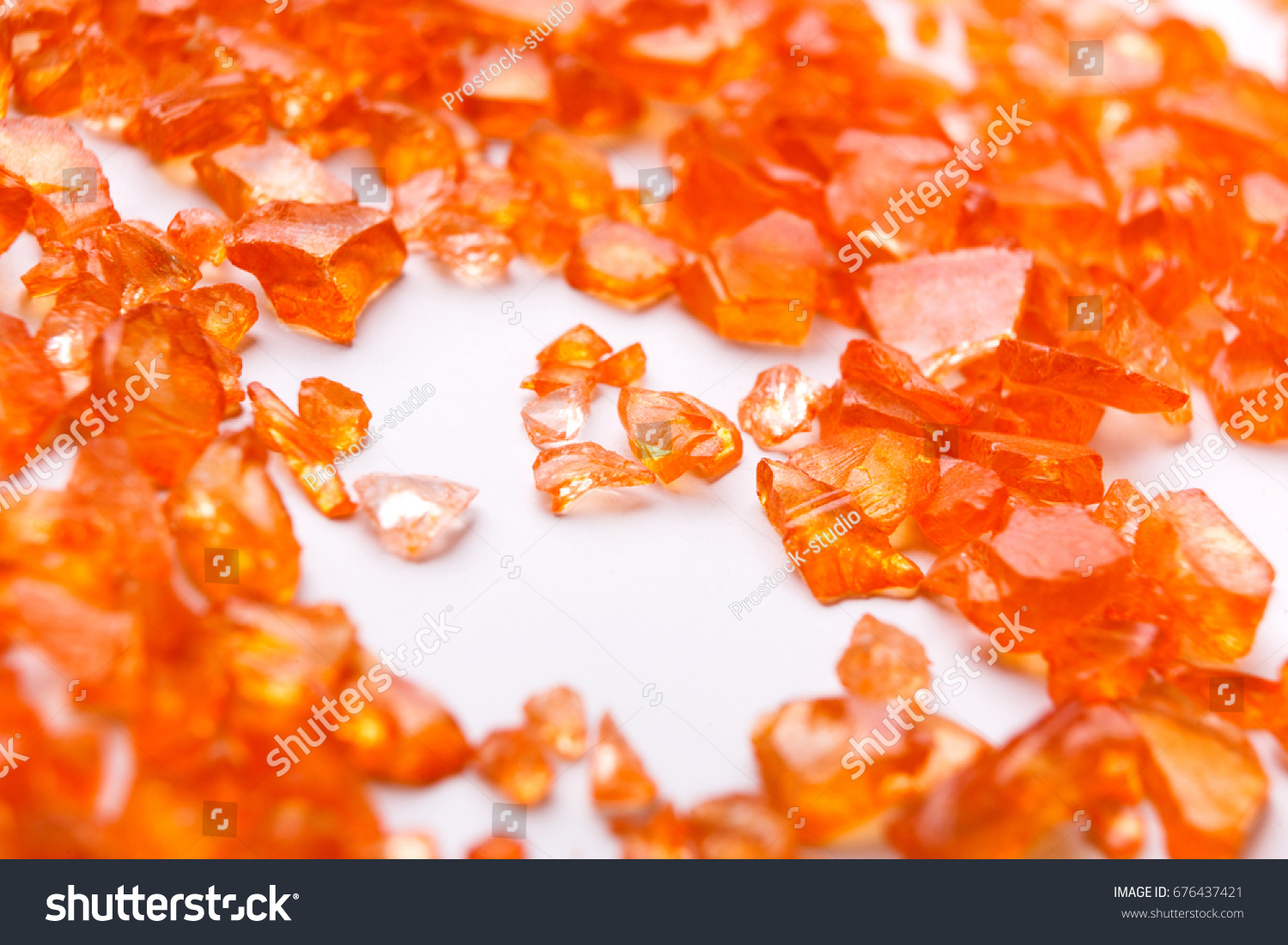 Orange Citrine gemstones on white background. Bright backdrop of natural jewels with free space for text, close up. #676437421