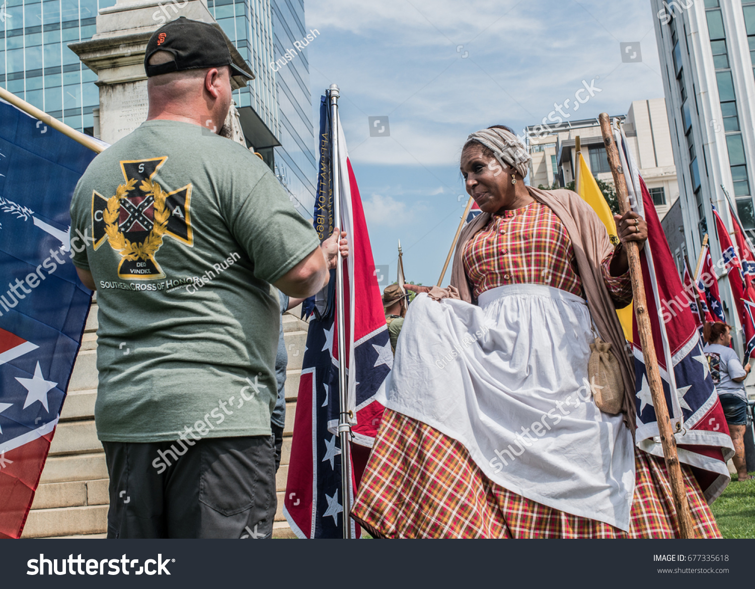 Columbia, South Carolina - July, 10, 2017: Confederate activist attend a flag raising event held in protest of the the Confederate flag's removal from the S.C. State House in 2015 #677335618