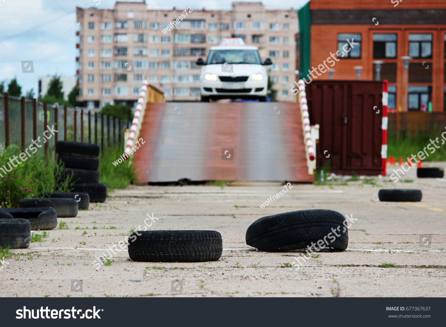 many Rubber tires from wheels are on site for training where drivers learn to ride on cars. The driver completes the entry and exit from the inclined surface #677367637