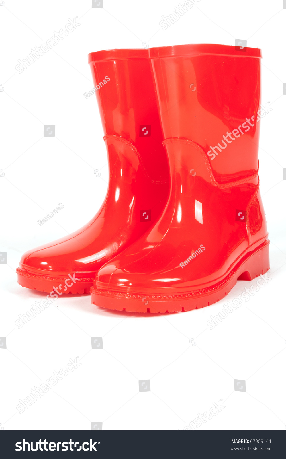 A pair of red rainboots on a white background #67909144