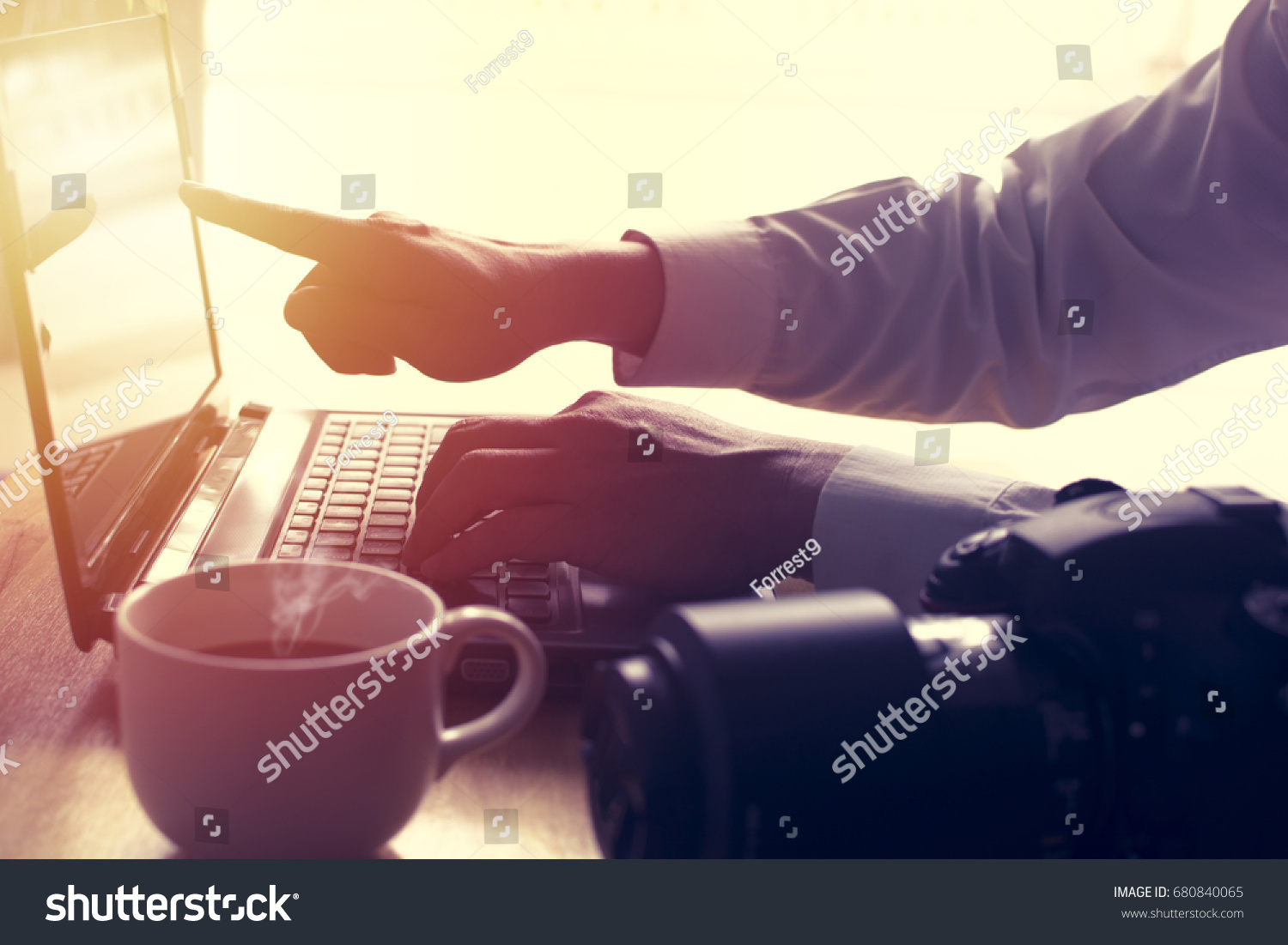 Man hand is using laptop and pointing on screen. Soft focus on hand. #680840065