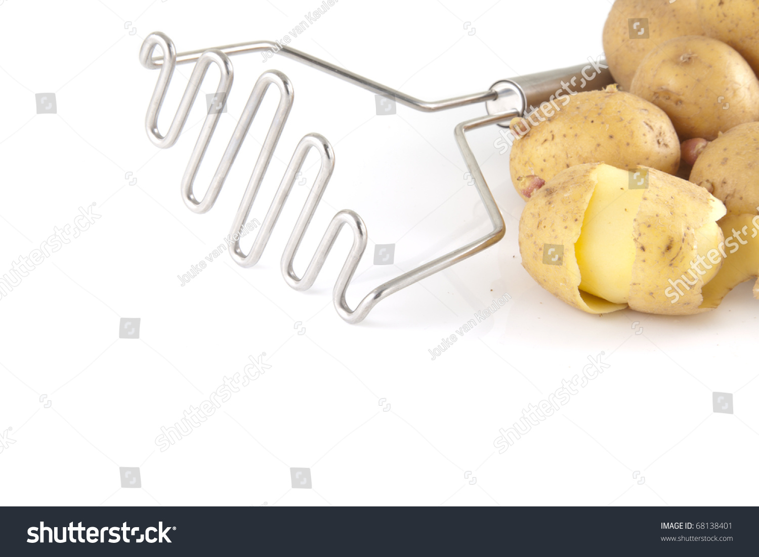 Masher with potatoes on a white background. #68138401