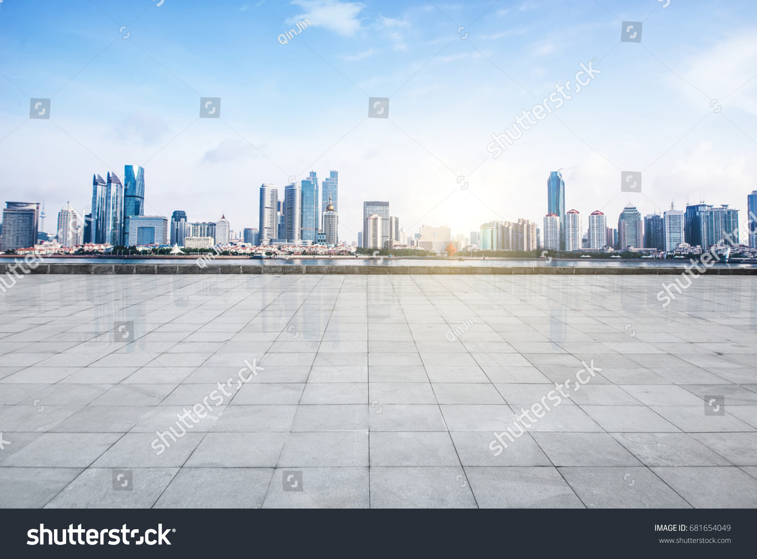 Panoramic skyline and buildings with empty concrete square floor #681654049