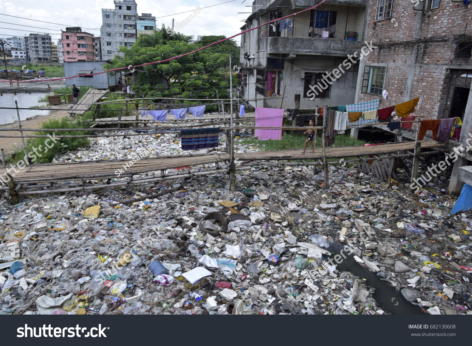 DHAKA, BANGLADESH - JULY 22, 2017: A canal full with wastage and plastic materials in Dhaka, Bangladesh on July 22, 2017. #682130608