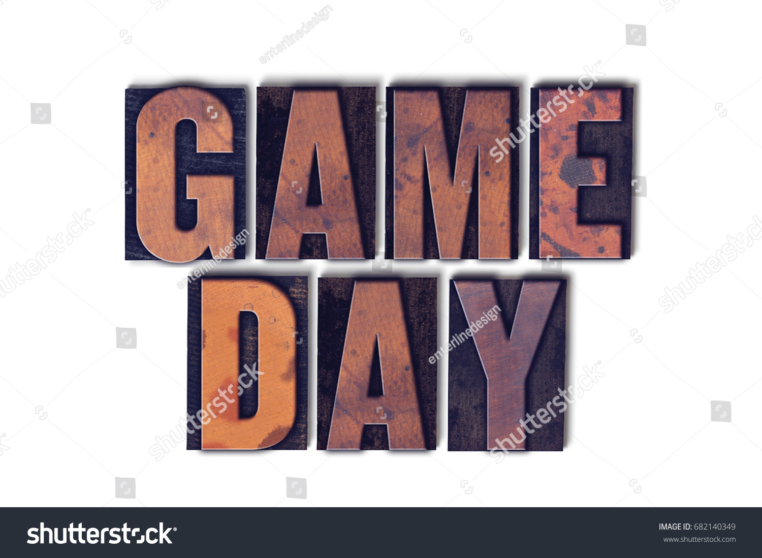 The words Game Day concept and theme written in vintage wooden letterpress type on a white background. #682140349