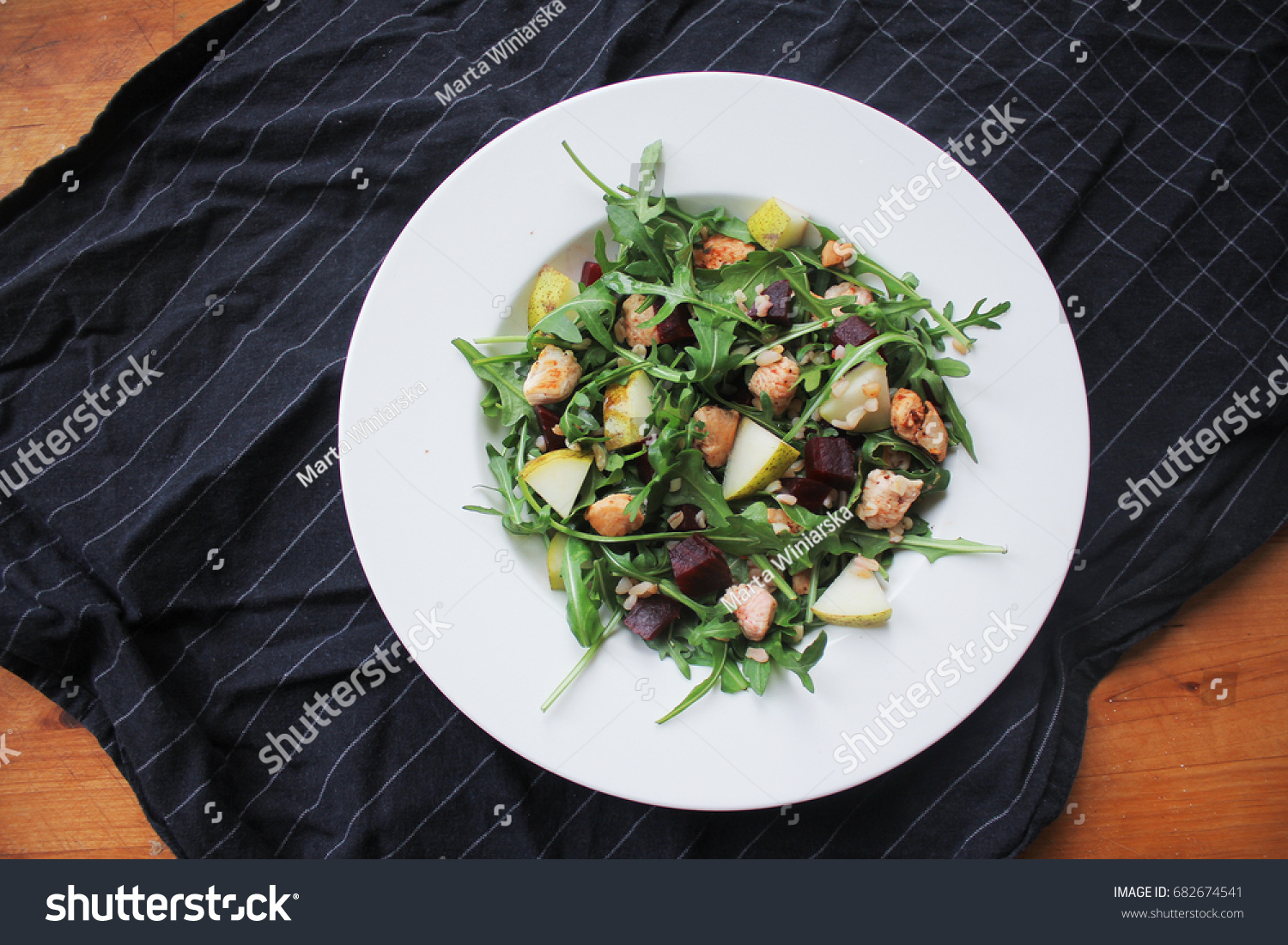 fresh arugula salad with chicken pear and beetroot #682674541
