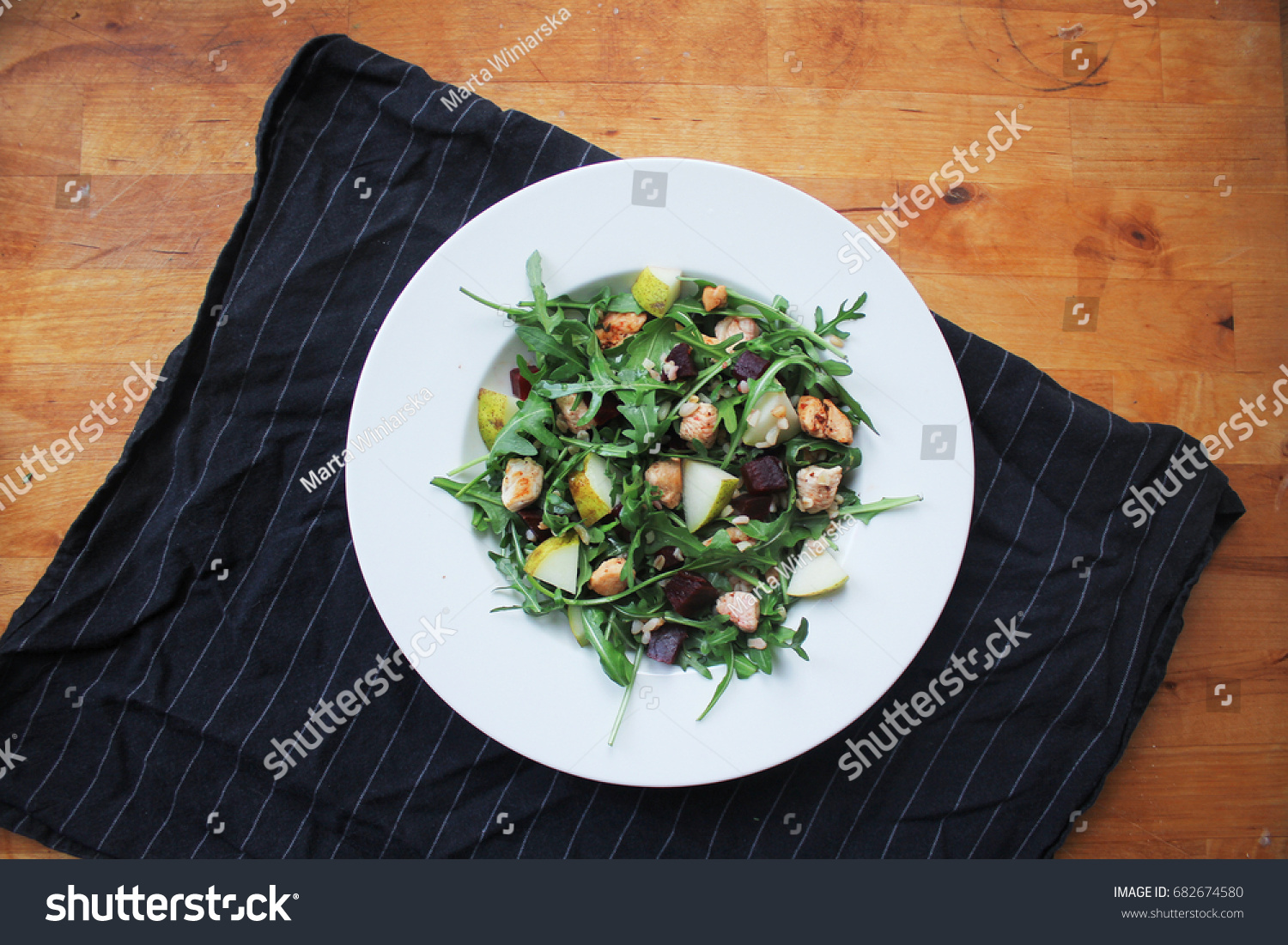 fresh arugula salad with chicken pear and beetroot #682674580