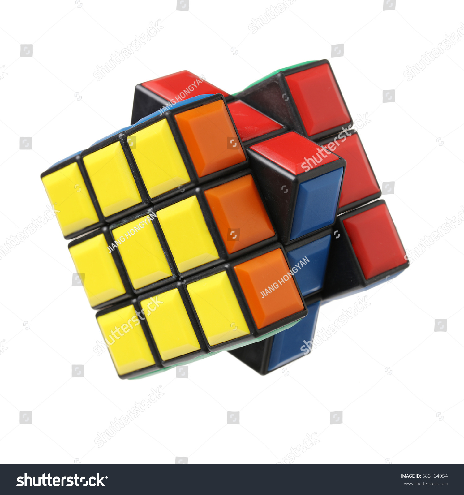 KRAGUJEVAC, SERBIA - DECEMBER 13, 2015: Rubik's 3x3x3 classic cube on a white background. Rubik's Cube invented by a Hungarian architect Erno Rubik in 1974. #683164054