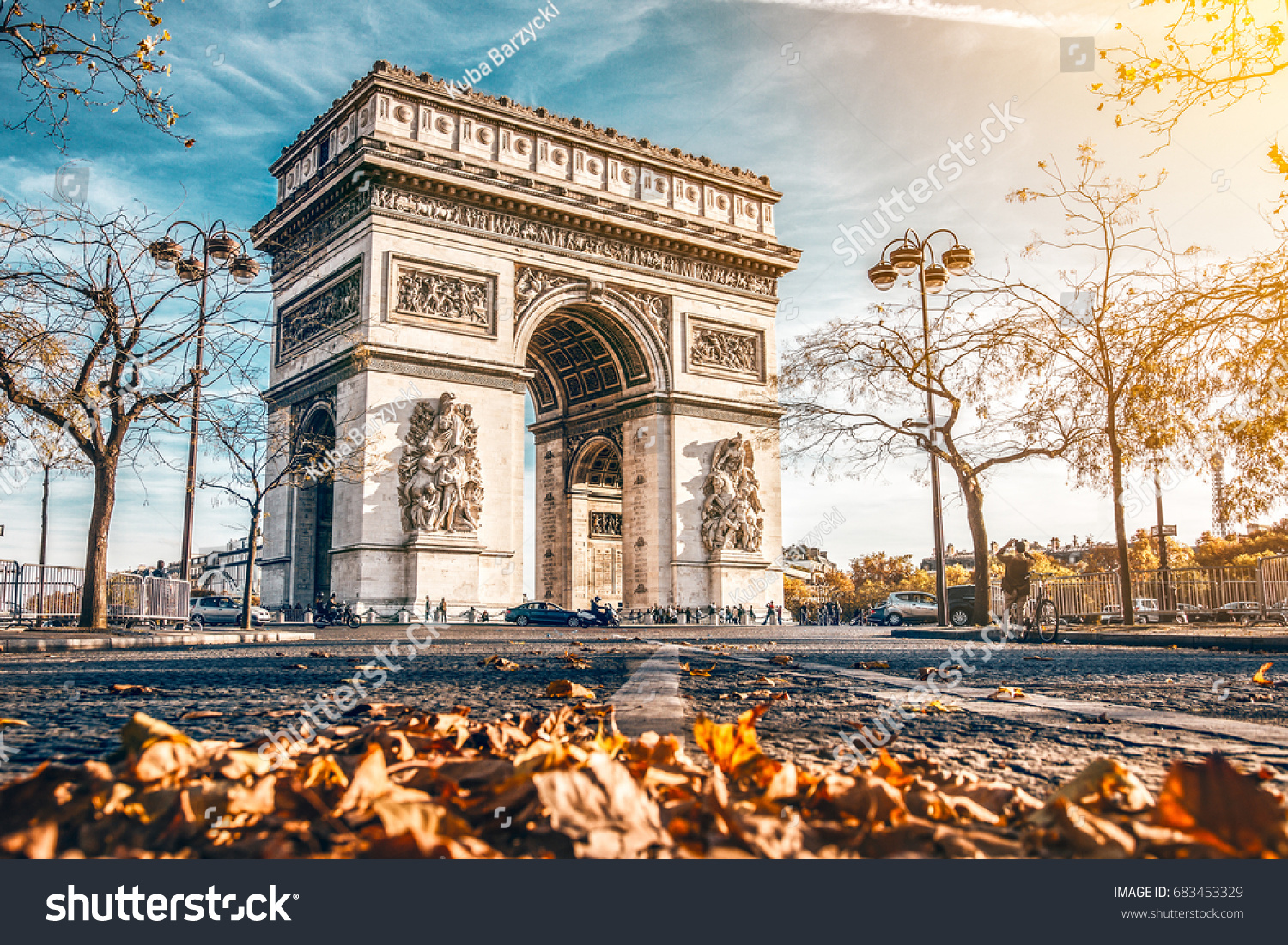 Arc de Triomphe located in Paris, in autumn scenery. #683453329