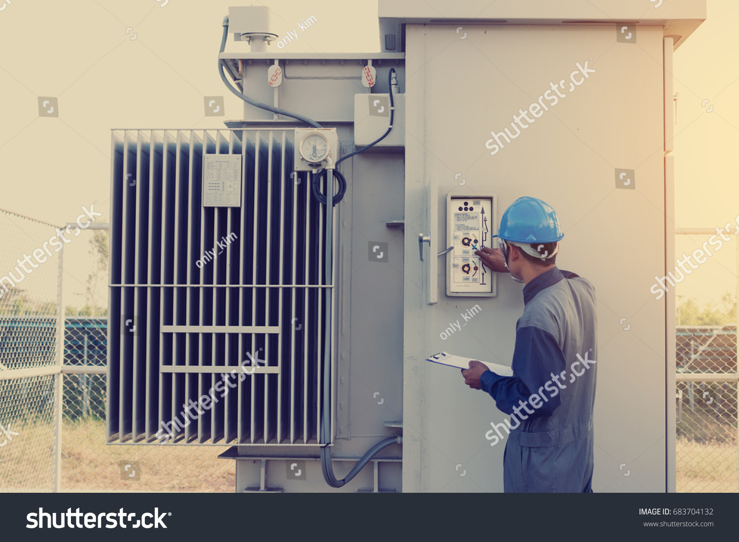 electrician working on checking status step up transformer high voltage on transformer yard and solution problem to operate at green energy solar power plant #683704132
