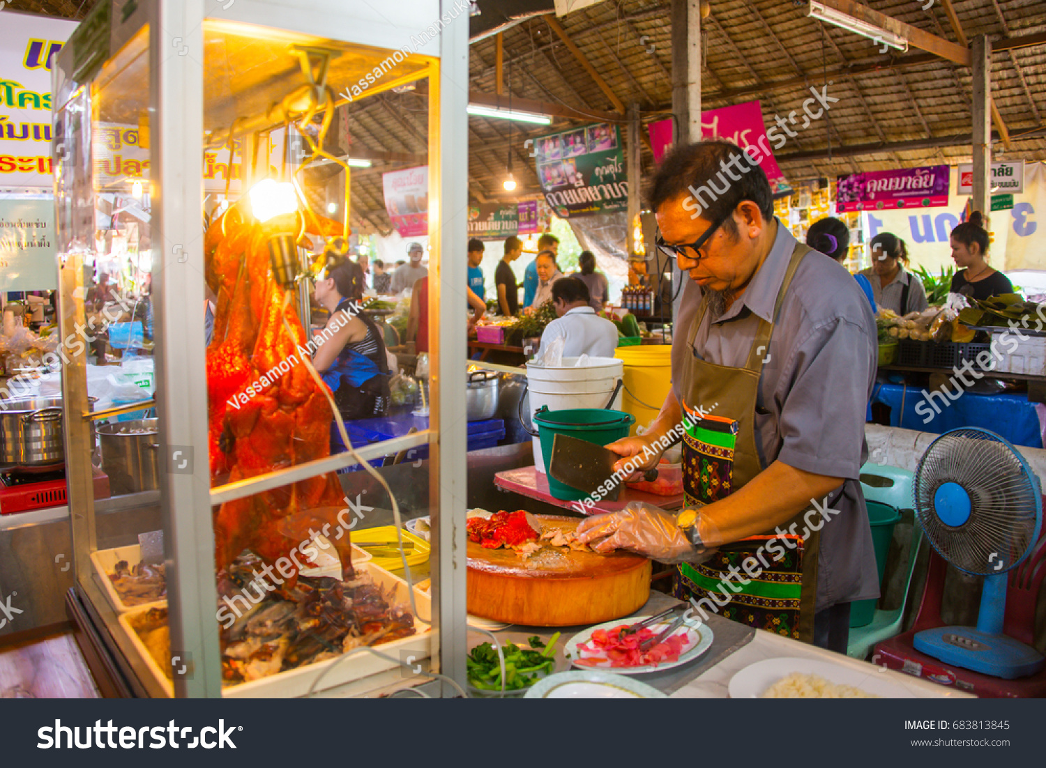 Bangkok, THAILAND -April 04 2017 - A man sell roasted duck at local flea market #683813845