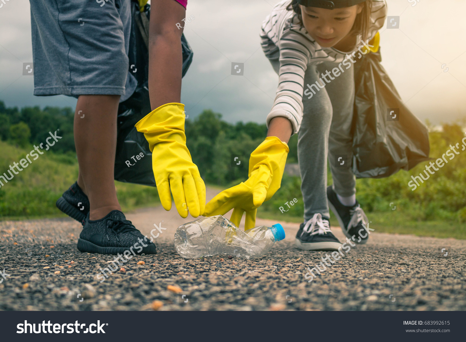 Group of kids volunteer help garbage collection charity environment. #683992615