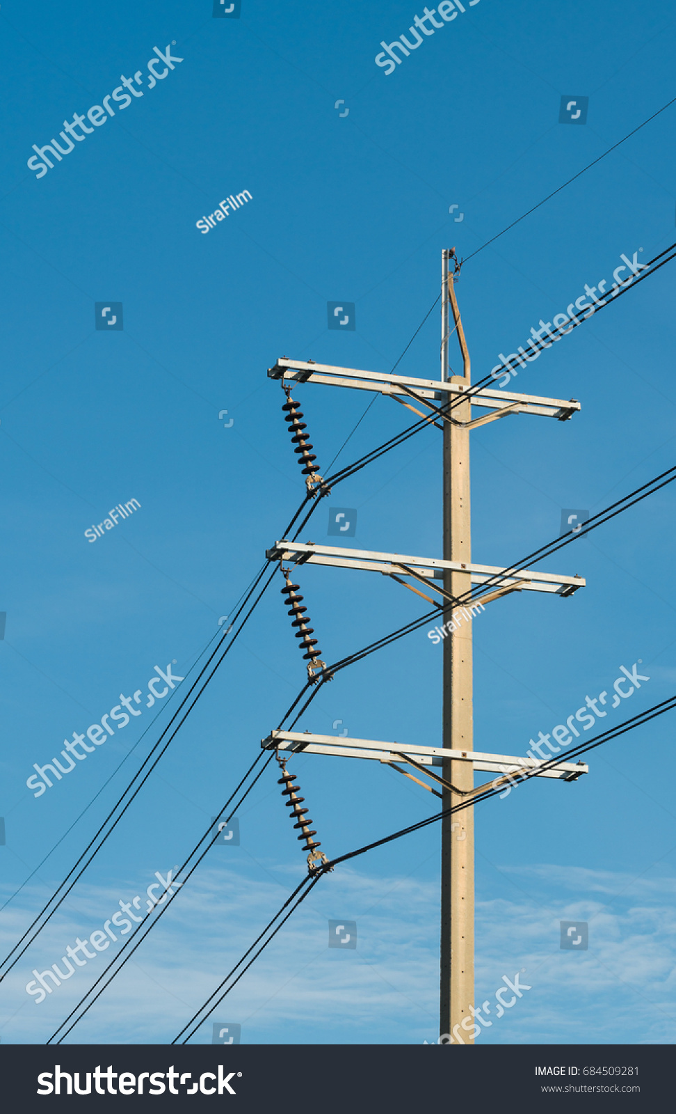 3 phases powerlines pose with blue sky background #684509281