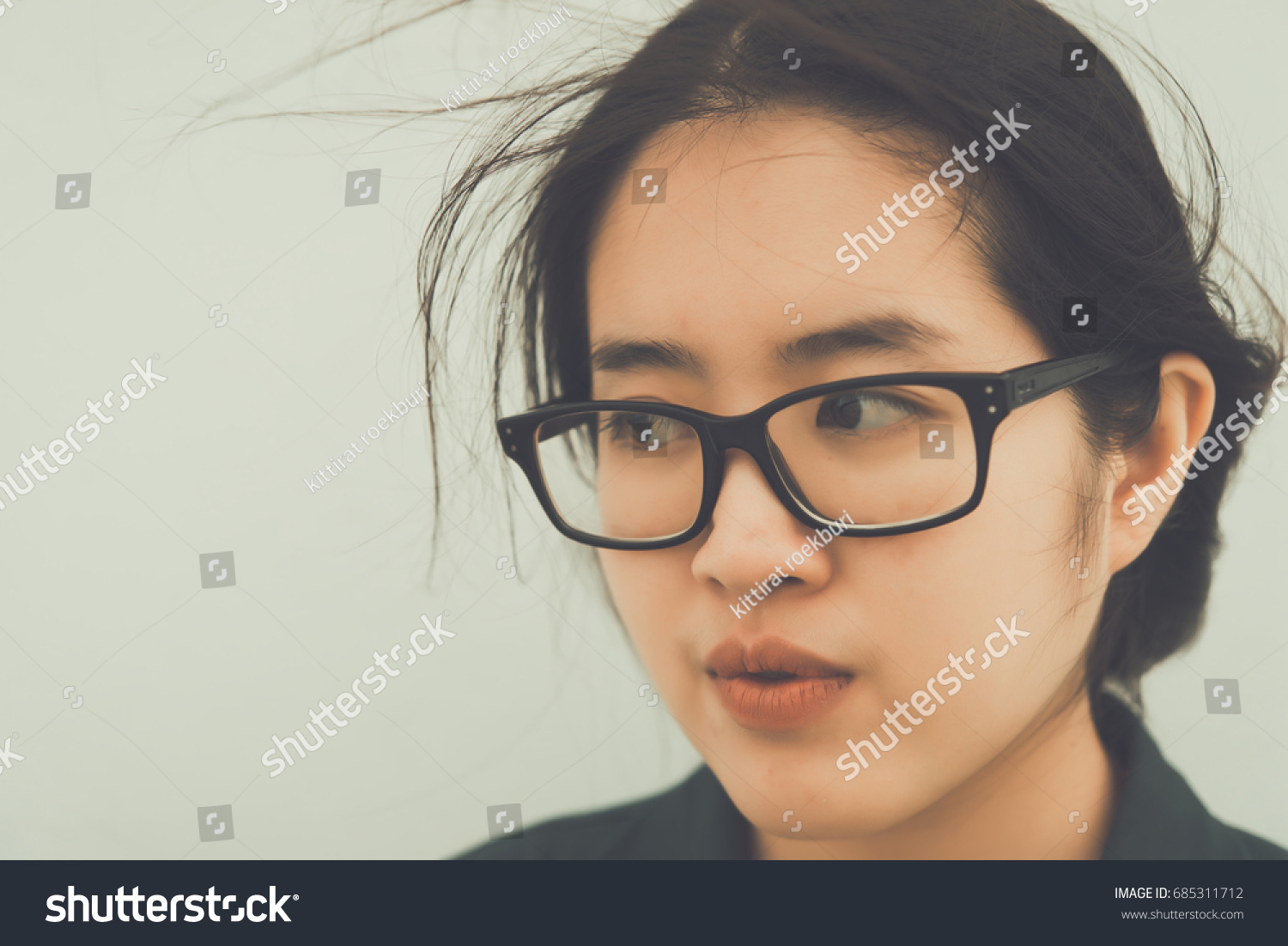 Close up beautiful asian woman wear glasses,Thai girl very pretty,sad woman concept,heartbreak from love,broken heart from boyfriend #685311712