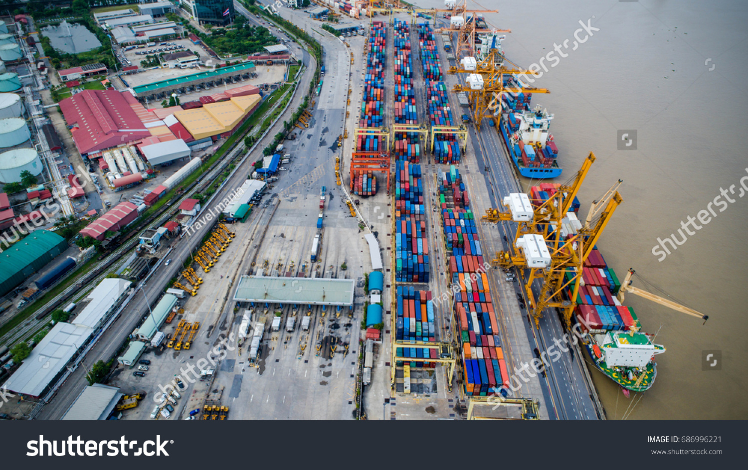 Container ship in import export and business logistic, By crane, Trade Port, Shipping cargo to harbor, Aerial view from drone, International transportation, Business logistics concept #686996221