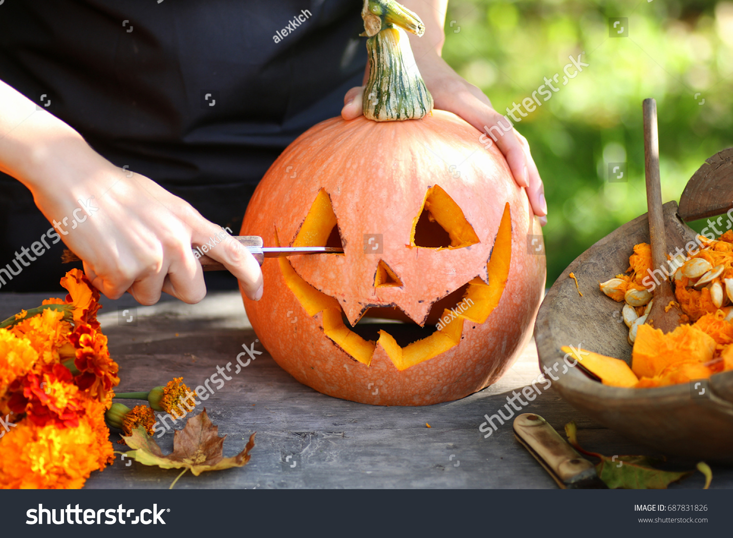 carve pumpkins for Halloween #687831826