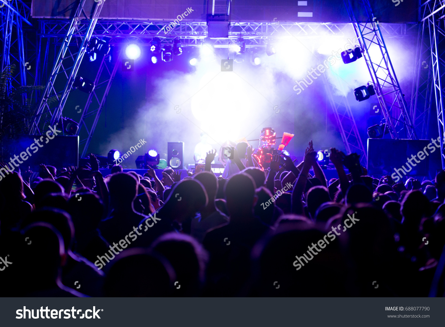 Crowd at concert and blurred stage lights #688077790