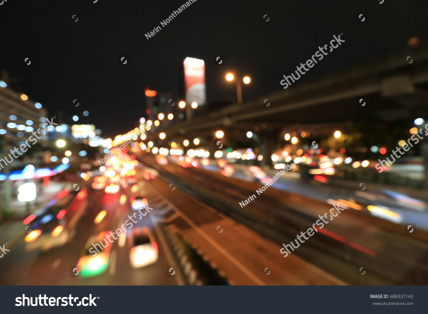 Abstract circular bokeh motion lens blur backround of city and street light at blue night time in Thailand. #688337143