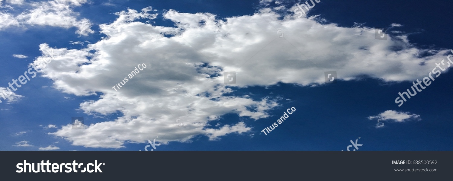 beautiful blue sky with clouds background.Sky clouds.Sky with clouds weather nature cloud blue.Blue sky with clouds and sun #688500592