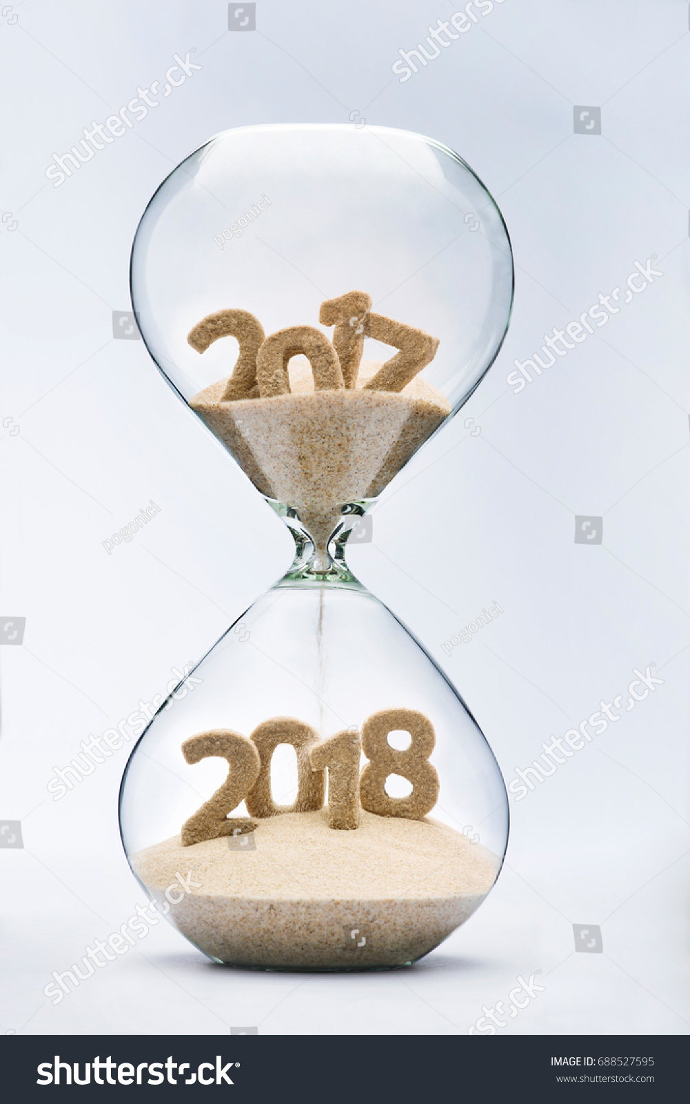 New Year 2018 concept with hourglass falling sand taking the shape of a 2018 #688527595