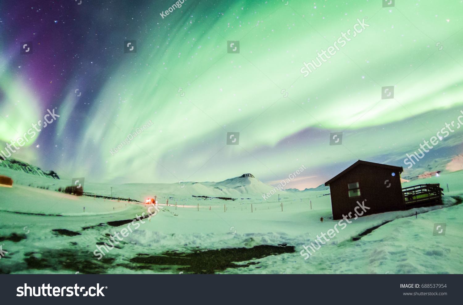 Aurora Borealis or better known as The Northern Lights for background view in Iceland, Reykjavik during winter #688537954