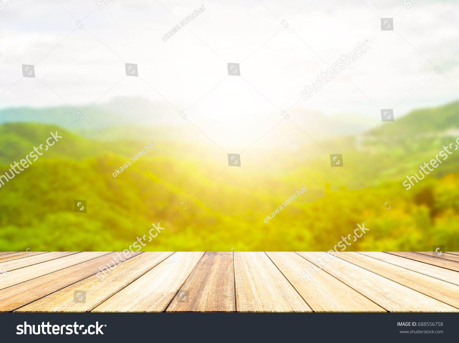 Perspective wood deck overlook the mountains  background atmosphere as the sun sets. Services include product display  template #688556758