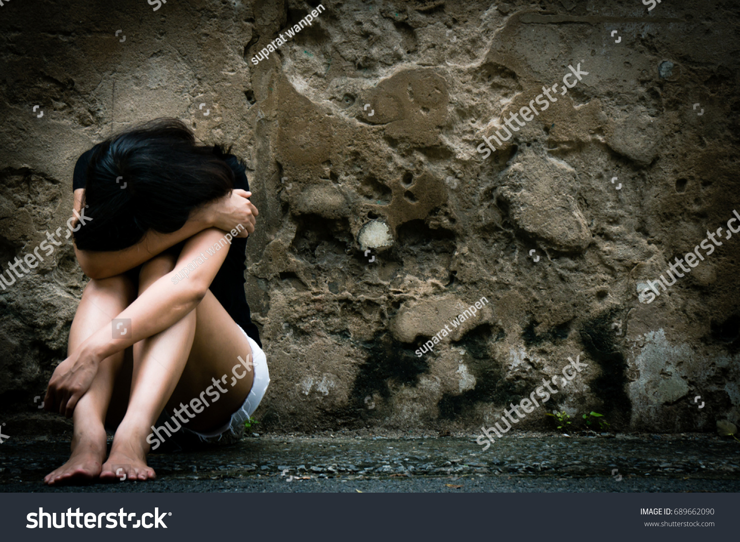 Lonely woman sitting on the floor near old wall vintage tone,sad depression, violence, bipolar concept, hard contrast,soft focus #689662090