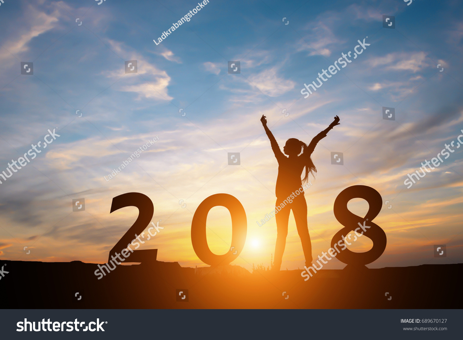 Silhouette of happy woman with New year 2018 concept in sunset background. #689670127