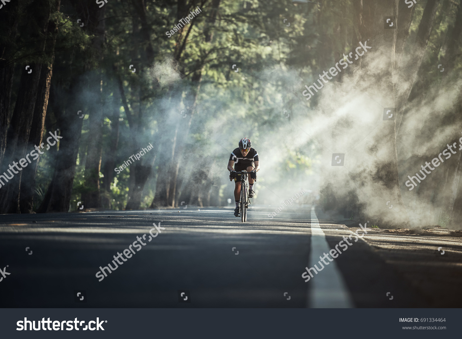 Asian men are cycling road bike in the morning #691334464