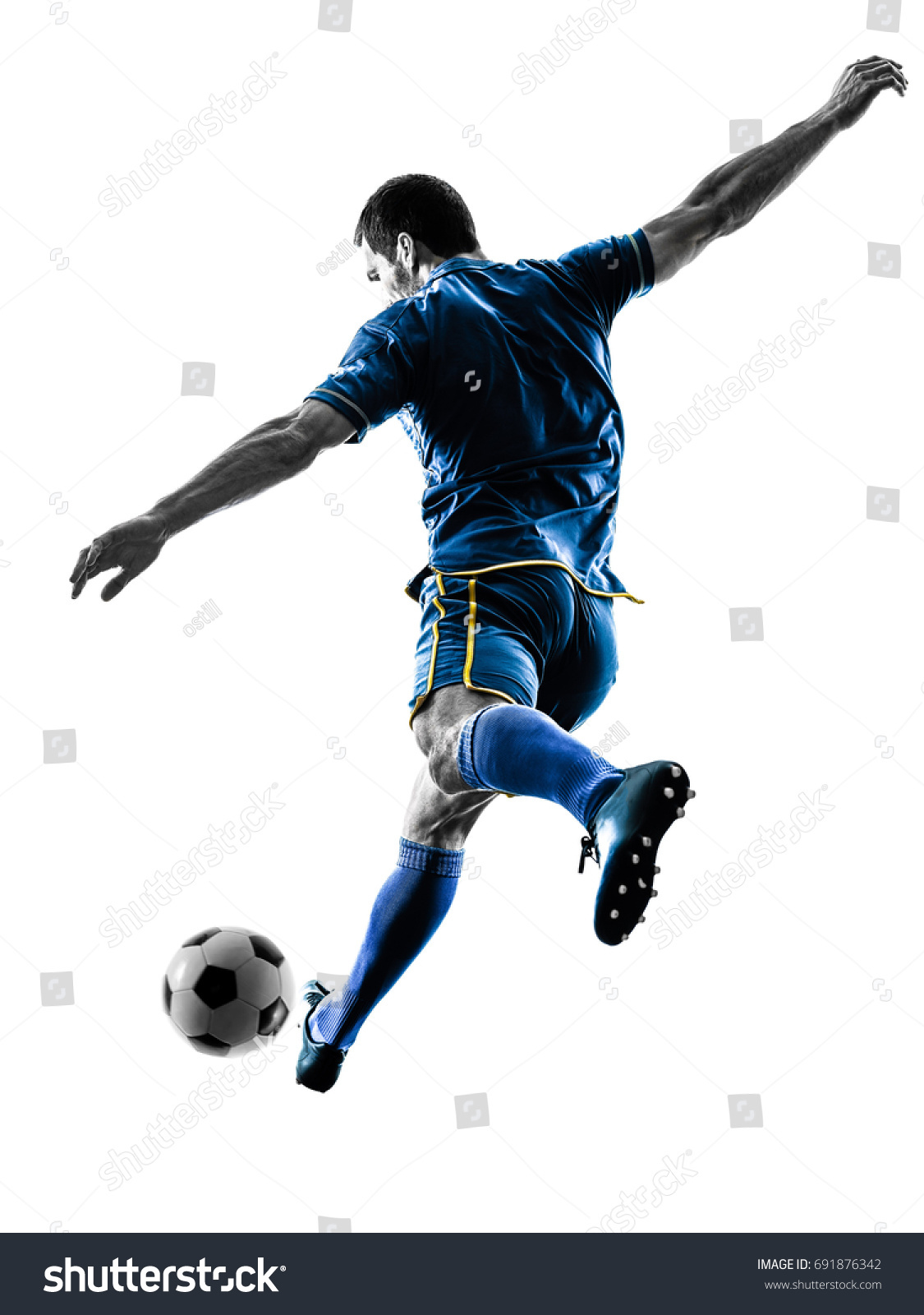 one caucasian soccer player man playing kicking in silhouette isolated on white background #691876342