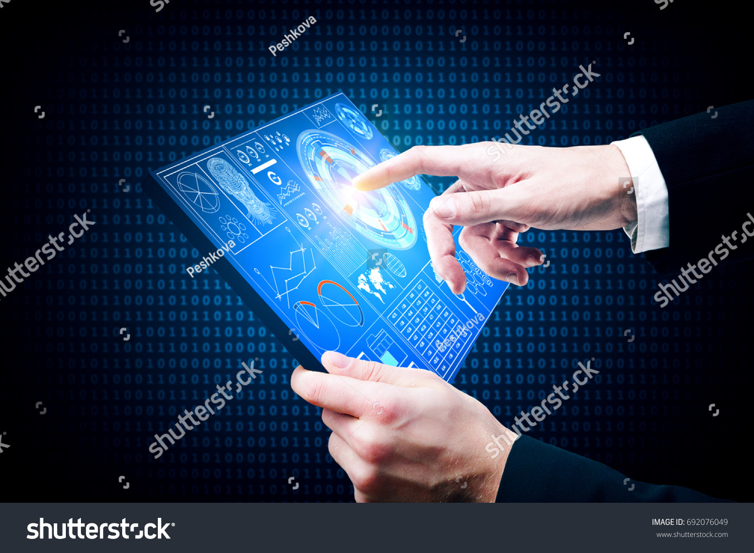 Businessman using tablet with business chart on screen. Future and technology concept  #692076049