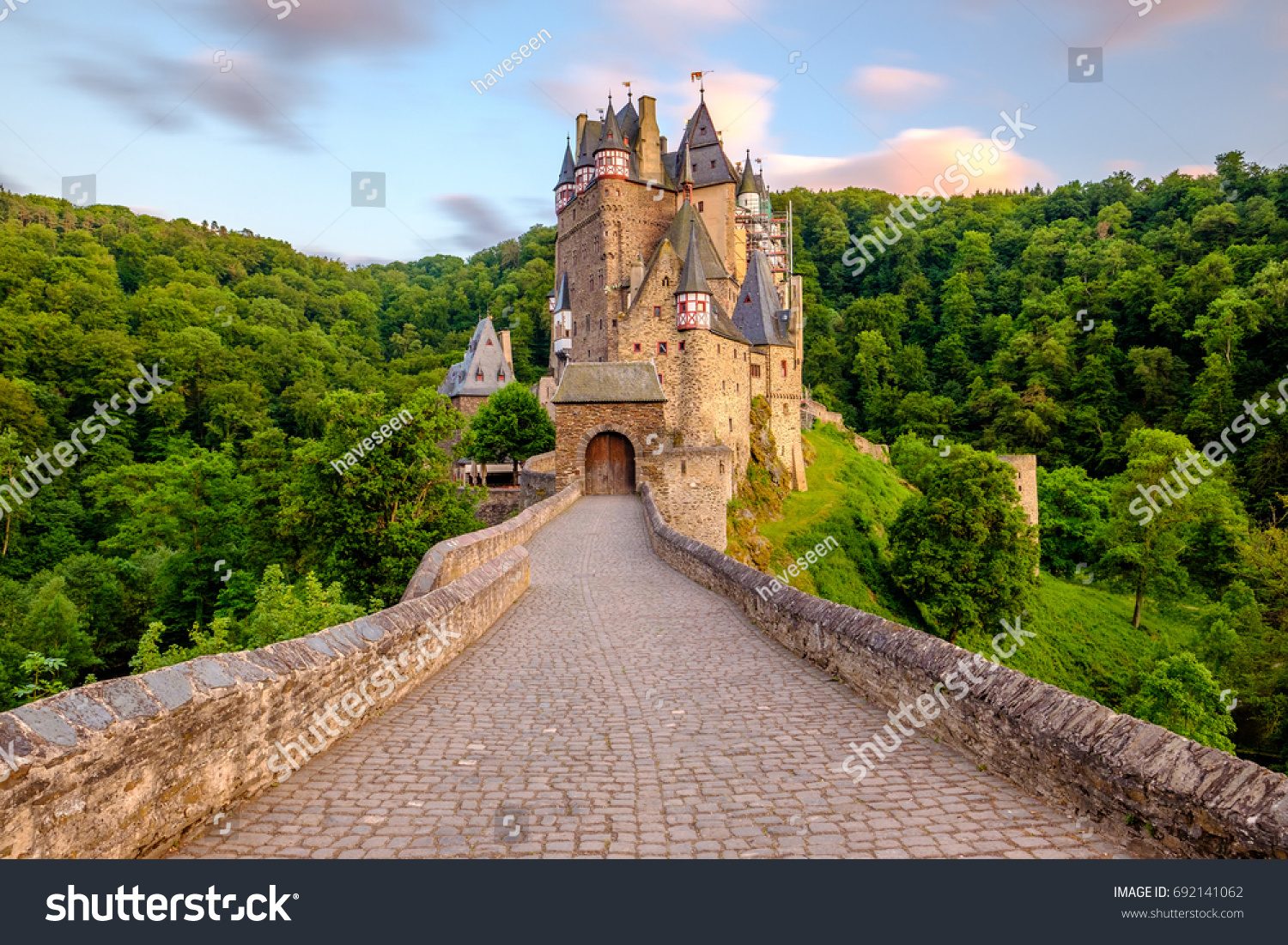 Burg Eltz castle in Rhineland-Palatinate state at sunset, Germany. Construction started	prior to 1157. #692141062