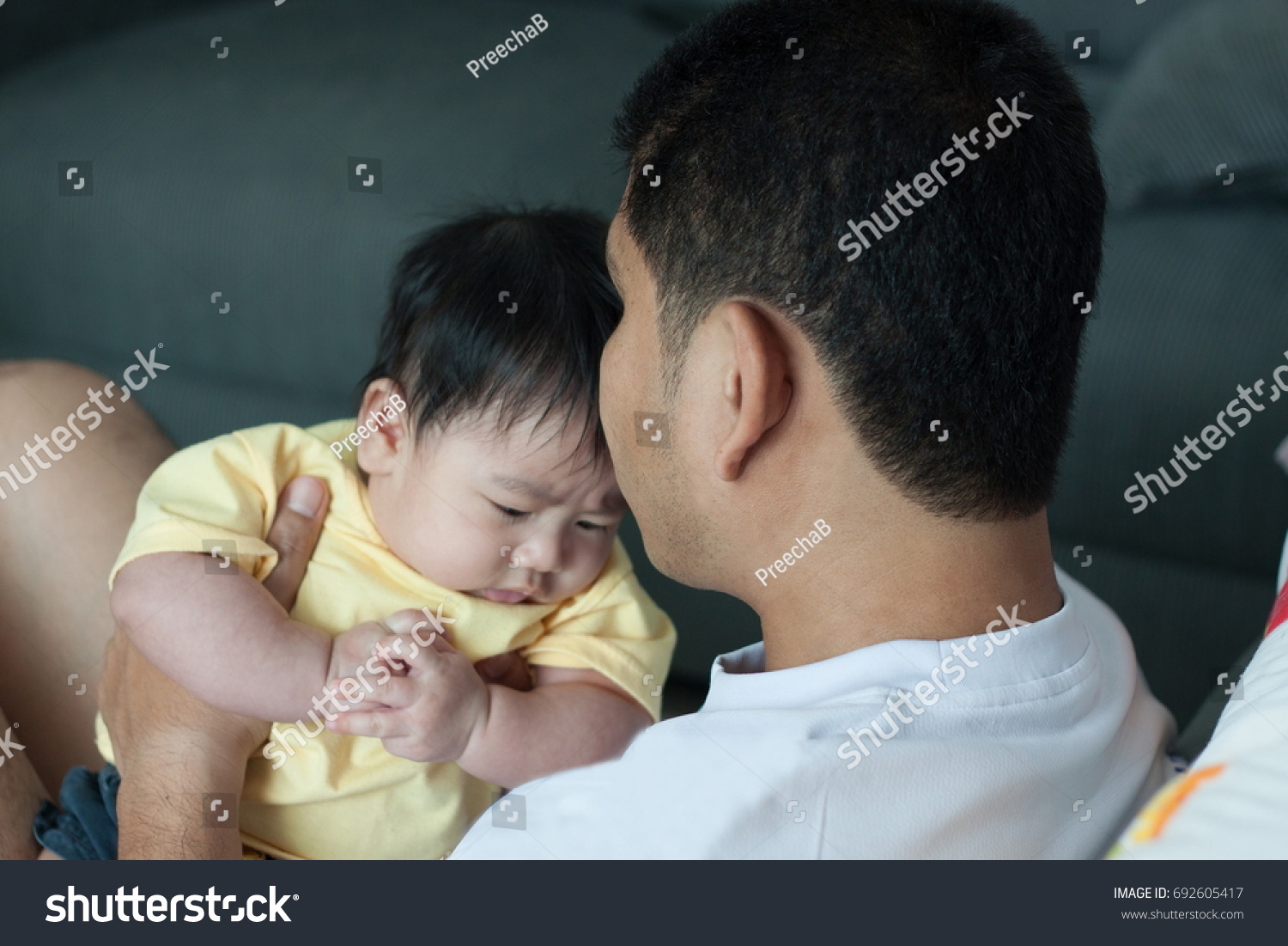 Baby happiness with father. #692605417