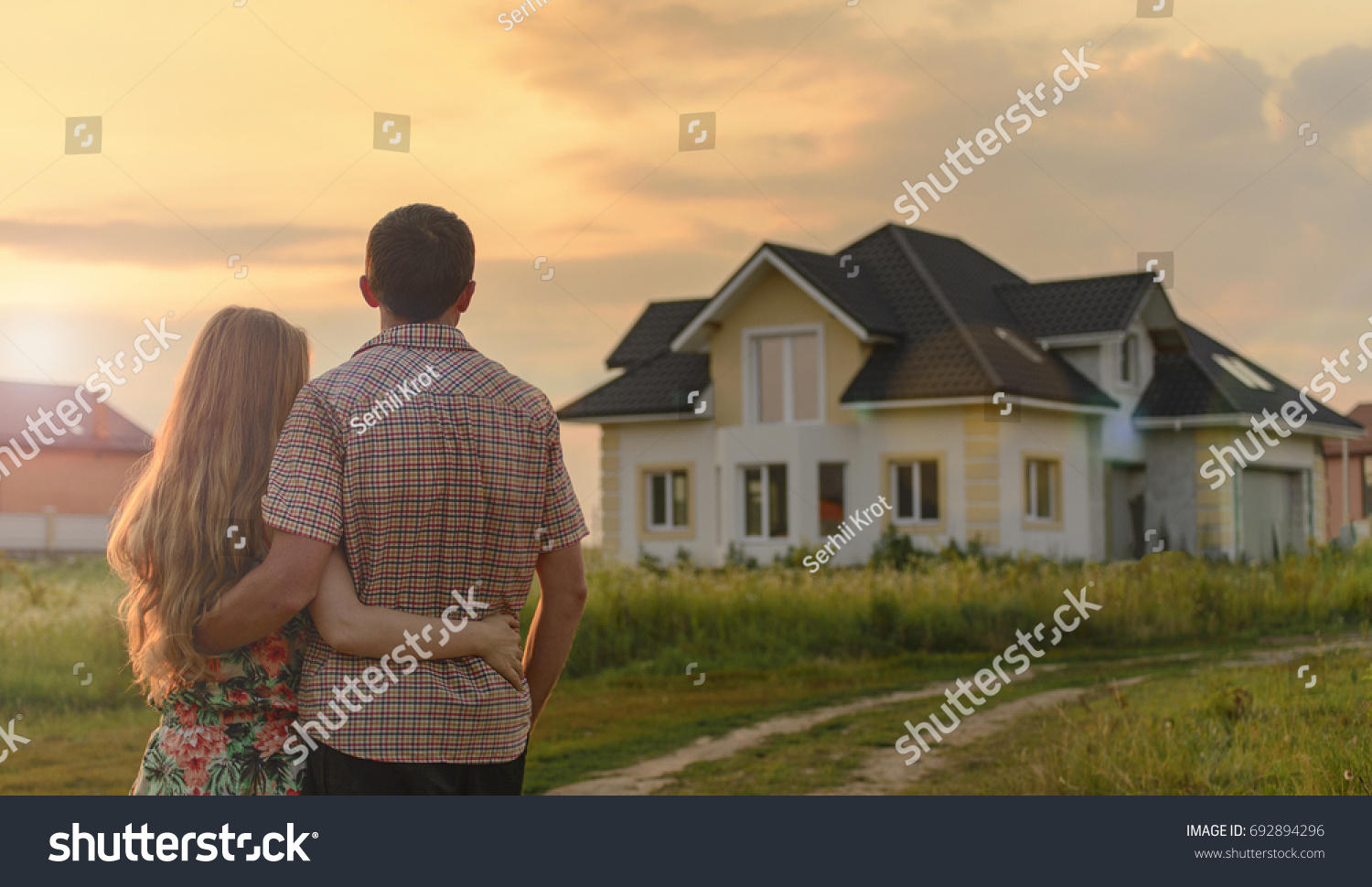 couple looking on house #692894296