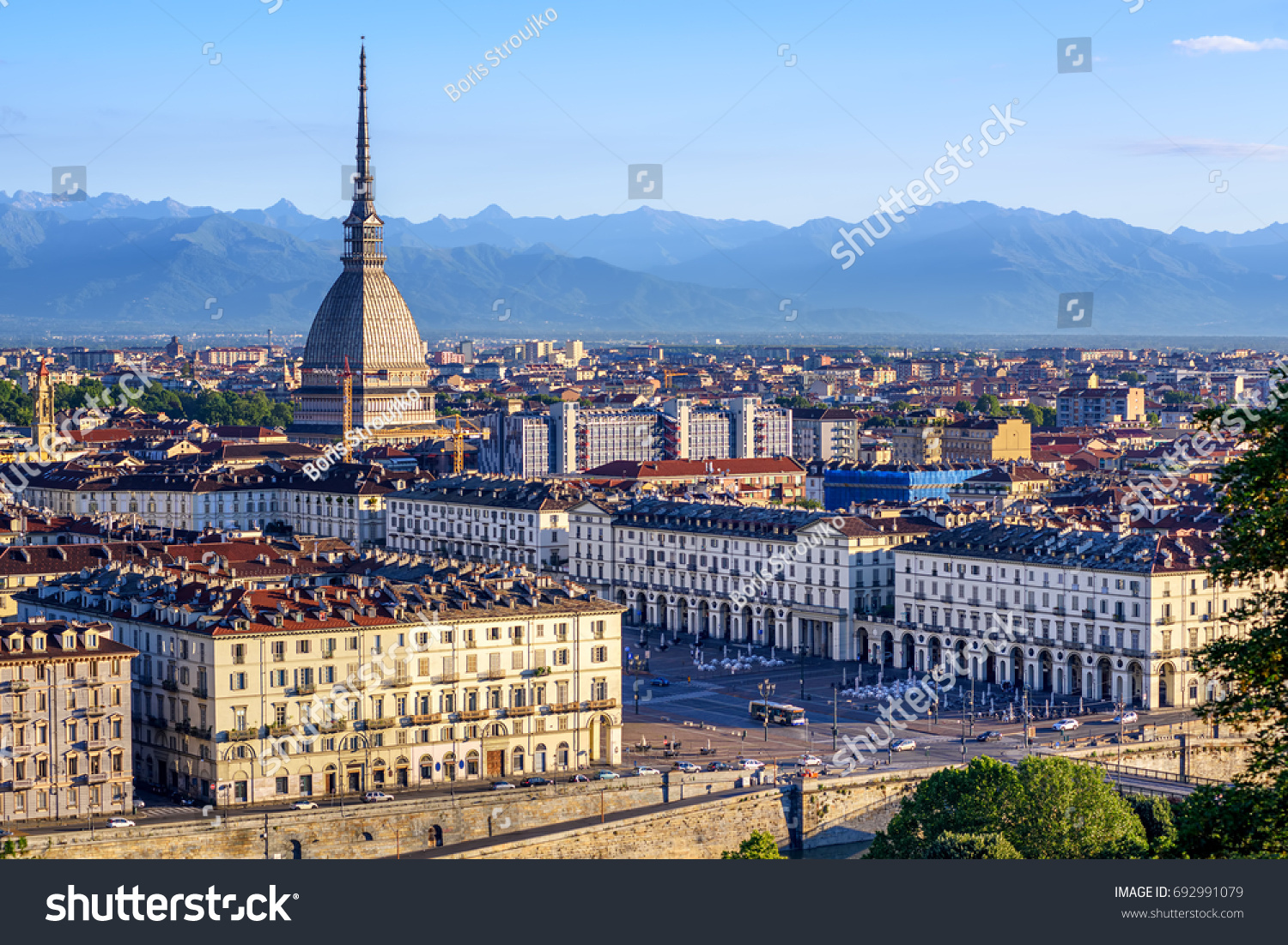 The city center of Turin with Mole Antonelliana tower and Alps mountains panorama, Turin, Italy #692991079