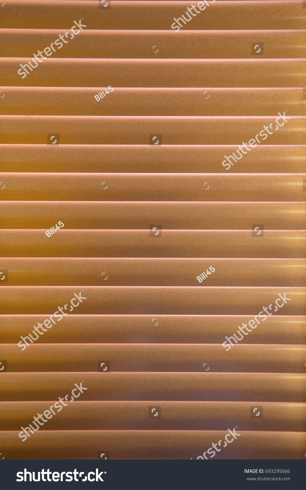 Horizontal pattern of gold venetian blinds in a gradation of color #693295666
