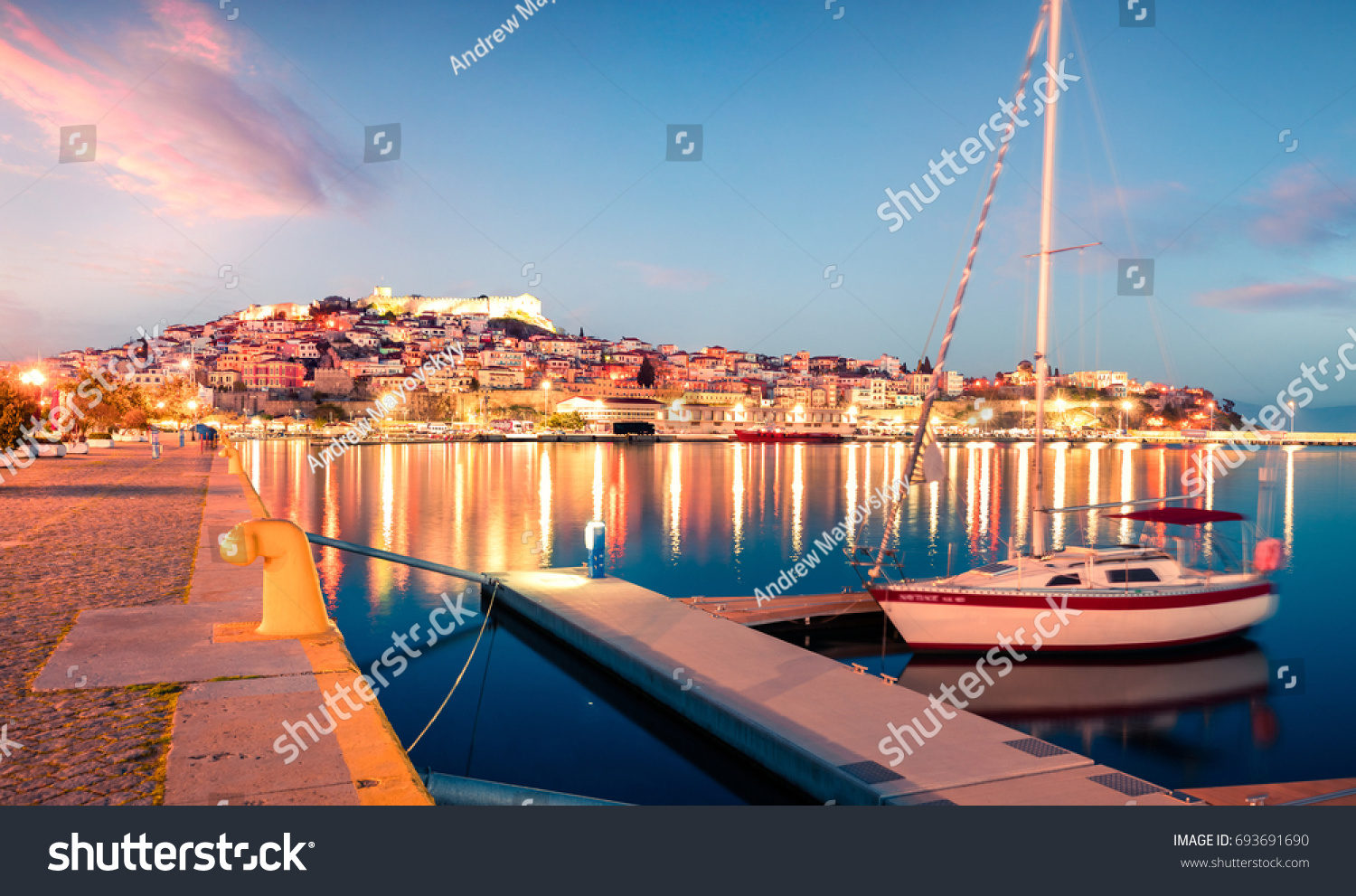 Splendid spring seascape on Aegean Sea. Colorful evening view of Kavala city, the principal seaport of eastern Macedonia and the capital of Kavala regional unit. Greece, Europe. #693691690