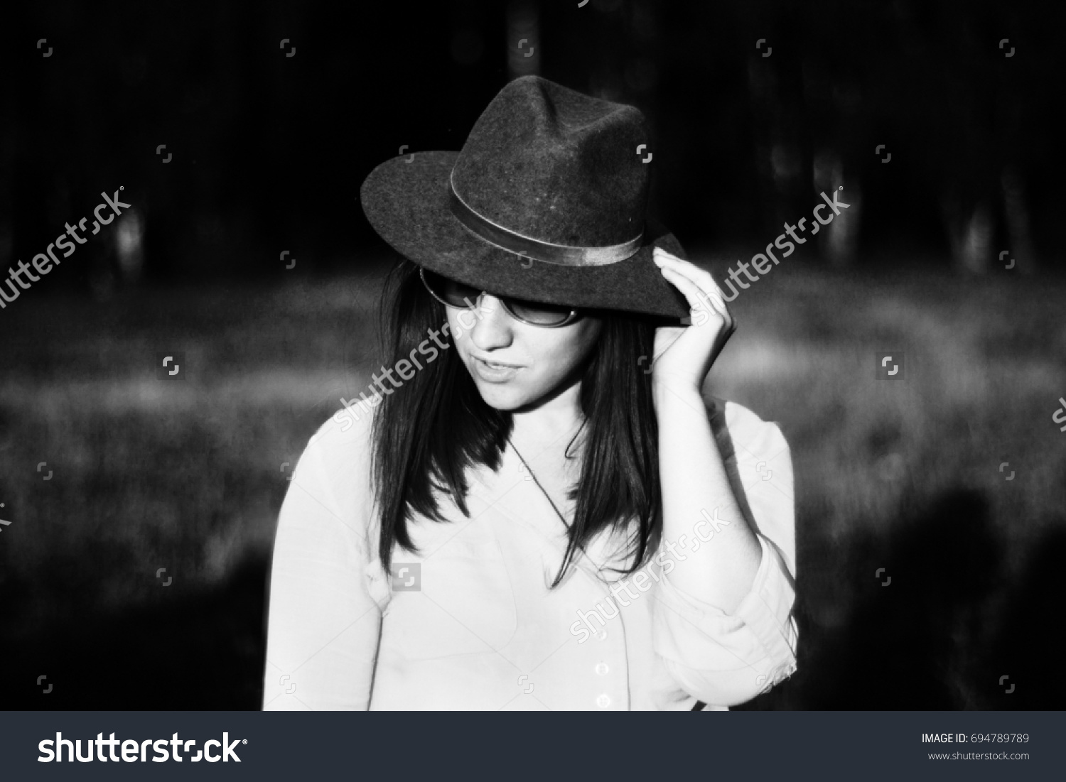 Black white photo of a girl in a hat #694789789