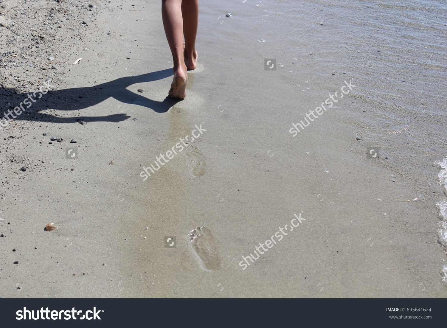 footprints in the sand #695641624