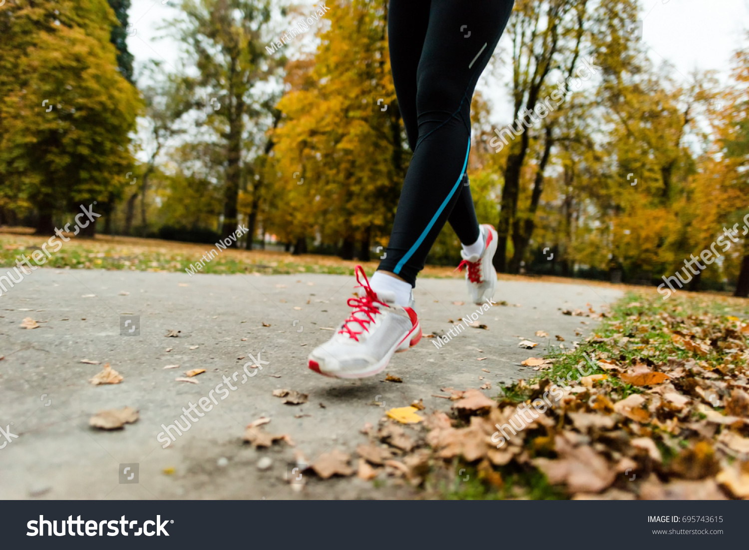 Sport, fitness and exercise concept - jogger woman. #695743615