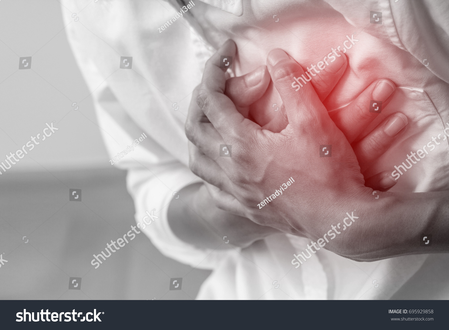 Man clutching his chest from acute pain.Heart attack symptom-Healthcare and medical concept. #695929858